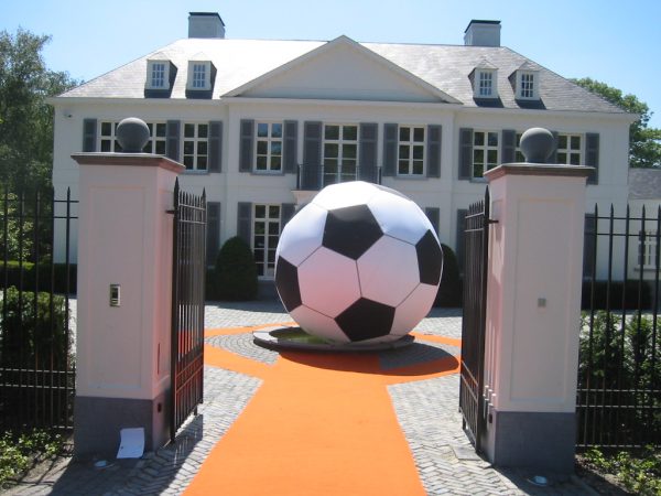 4m inflatable football outside in a courtyard